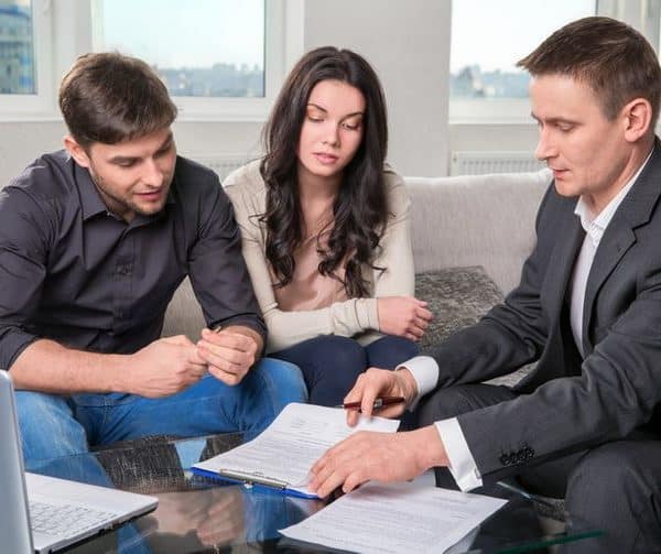Family reviewing documents with immigration advisor