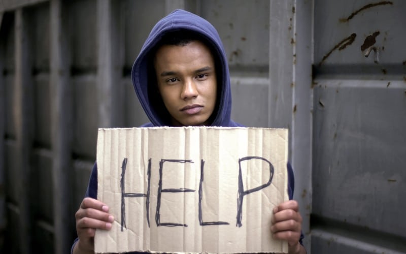 help sign begging afro american boys hands stop war refugee