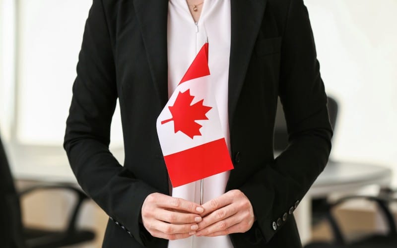 woman with canadian flag indoors
