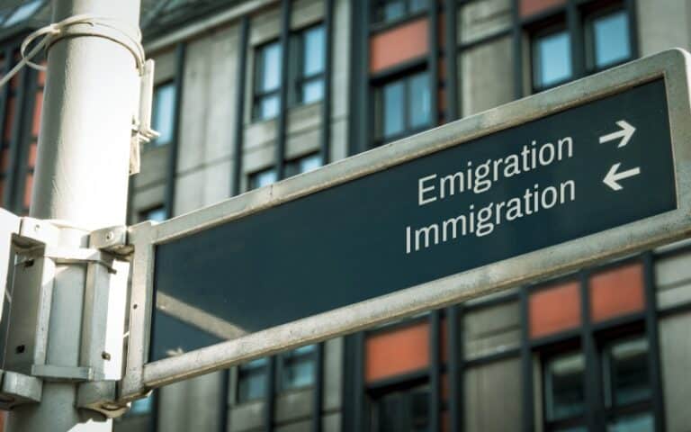 Street Sign Showing Immigration and Emigration - Immigration Direction