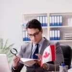 businessman with canadian flag in office