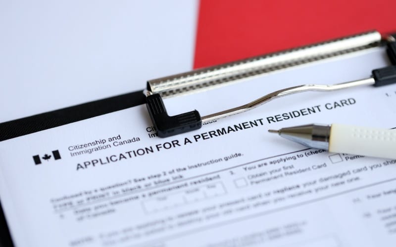 application permanent resident card table pen close