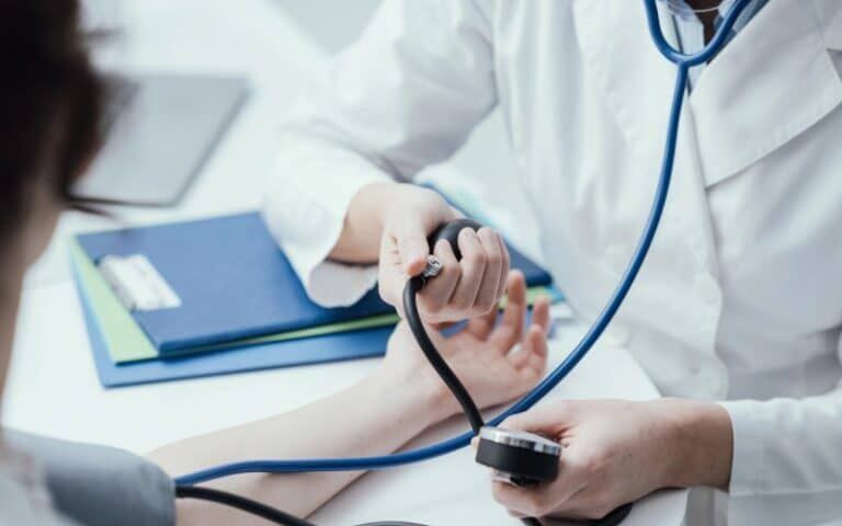 Doctor Checking Patient’s Blood Pressure - Medical Immigration