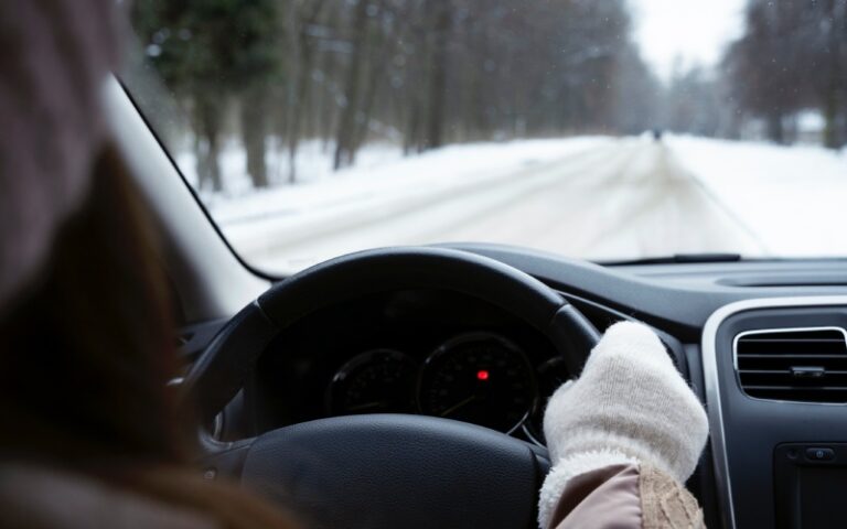 Close up woman driving winter season